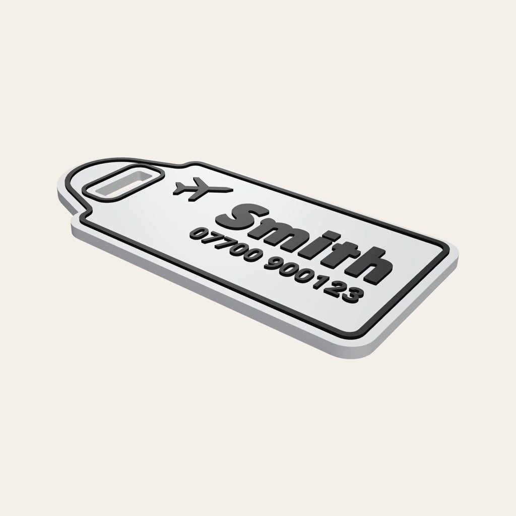 White & Black personalised luggage tag with a plane icon, the name Smith and a phone number