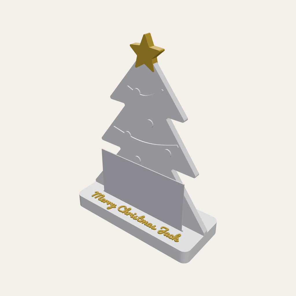 Christmas tree gift card holder in white and gold, a card in the slot and a name on the base