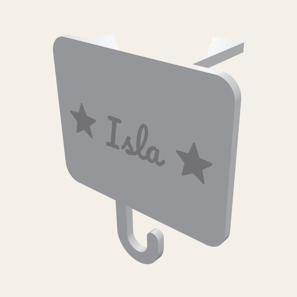 Personalised stocking holder in white and silver: a name plaque with stars, a mantel clip and a hook